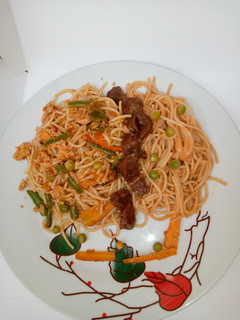 A picture of Egg scrambled spaghetti.