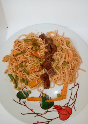 A picture of Egg scrambled spaghetti.