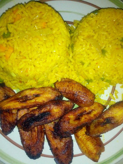A picture of Tumeric rice and fried plantain.