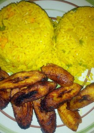 A picture of Tumeric rice and fried plantain.