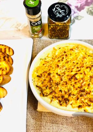 A picture of Baked vegetables with grilled garlic bread.