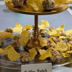 A picture of Golden snitch Cheese balls.