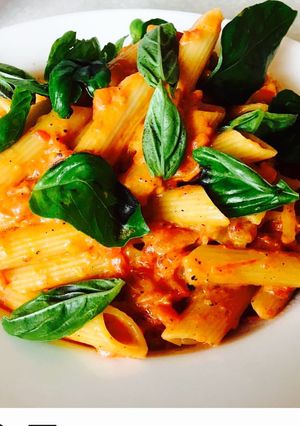 A picture of Basil cheesy red sauce pasta.