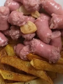 Una foto de Salchichas de cerdo al vino
