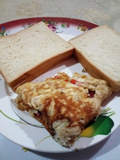 A picture of Buttered Bread with Fried Eggd.