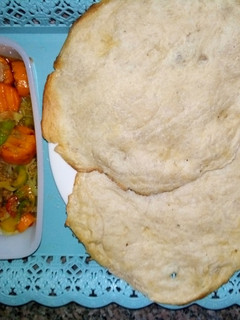 A picture of Local gurasa and minced meat sauce.