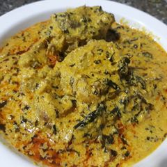 A picture of Egusi soup with bitter leaves.