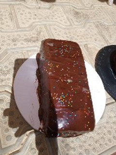 A picture of Chocolate cake loaf with chocolate gnache frosting.