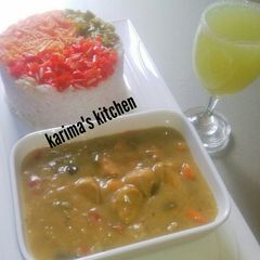 A picture of White rice/coconut curry saucs.