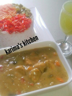 A picture of White rice/coconut curry saucs.