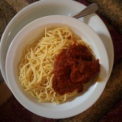 A picture of White spaghetti and stew.