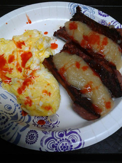 A picture of Spicy applesauce and sausage with eggs.