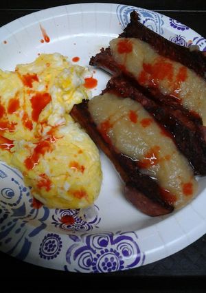 A picture of Spicy applesauce and sausage with eggs.