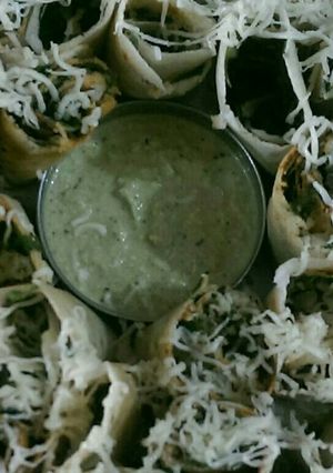 A picture of Cheese Paneer spinach dosa roll.
