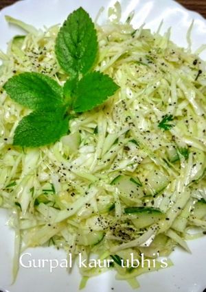 A picture of Young cabbage salad with cucumber.