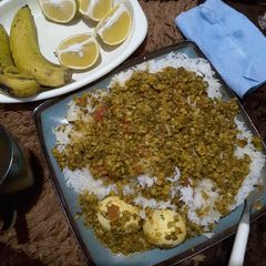 A picture of #theme challengeRice and split green grams with egg.