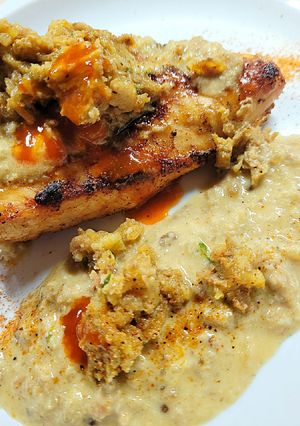 A picture of Chicken Boudin w Crabmeat Sauce.