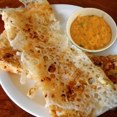 A picture of Onion rava maida dosa.