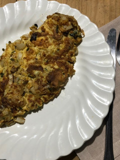 Una foto de Tortilla de cebolla y perejil