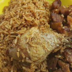 A picture of Jollof rice,chicken and dodo.