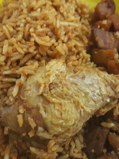 A picture of Jollof rice,chicken and dodo.