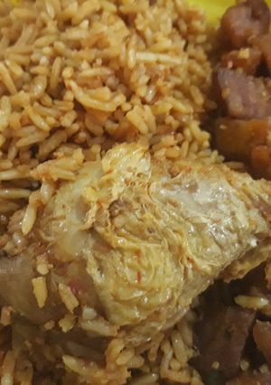 A picture of Jollof rice,chicken and dodo.