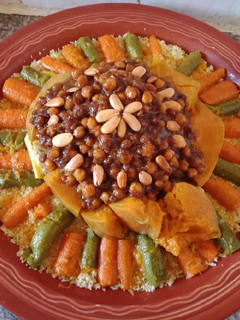 A picture of Moroccan Couscous with Vegetables, Raisins, and Chickpeas 😋👌.