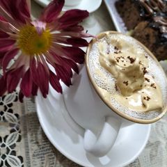 A picture of Hand beaten frothy coffee.