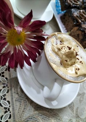 A picture of Hand beaten frothy coffee.