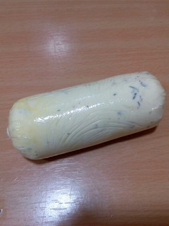 Una foto de Mantequilla con aceite de oliva y tomillo