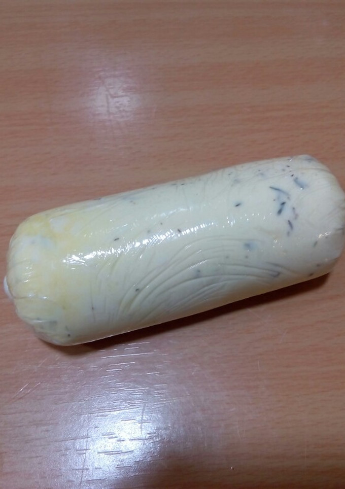 Una foto de Mantequilla con aceite de oliva y tomillo