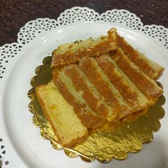 A picture of Healthy orange suji tea cake.