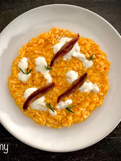 Foto di Risotto peperoni, crema di bufala e alici