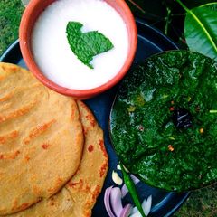 A picture of Sarson Ka Saag, Makai Ki Roti Or Namkeen Lassi.