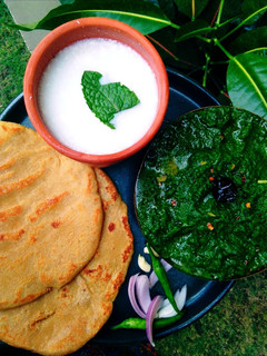 A picture of Sarson Ka Saag, Makai Ki Roti Or Namkeen Lassi.