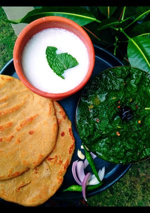 A picture of Sarson Ka Saag, Makai Ki Roti Or Namkeen Lassi.
