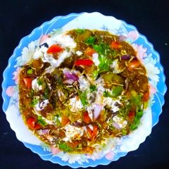 A picture of Chhole With Stuff Tikki Chaat.
