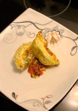 A picture of Easy Cheesey Spicy Jerk Egg Soufflé with peppers & bacon.