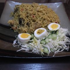 A picture of Palm oil noodles with dried Mangala fish.