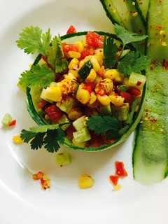 A picture of Corn cucumber tomato salad.
