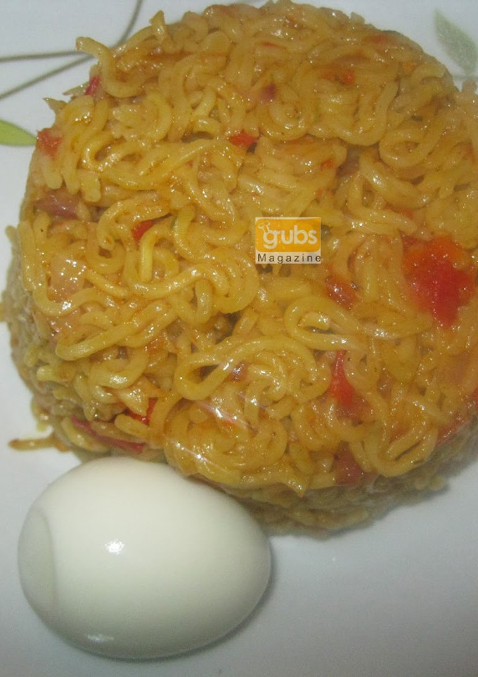 A picture of Jollof noodles with boiled egg.