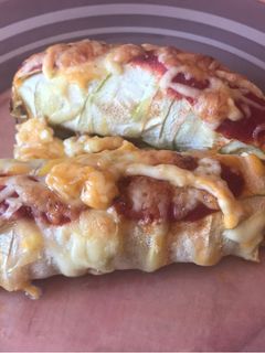 Una foto de Canelón de Calabacín, relleno de carne en tomate(restos del puchero)
