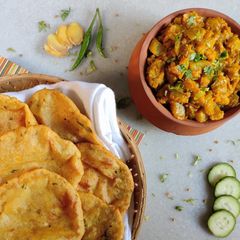 A picture of Aloo ki poori with Khatha Meetha Petha (kaddu).