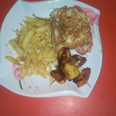 A picture of Chips nd Eggs with plantain ring!#breakfast.