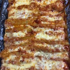 A picture of Spinach and ricotta cheese with cannelloni.