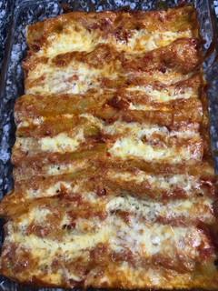 A picture of Spinach and ricotta cheese with cannelloni.