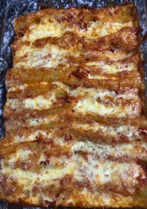 A picture of Spinach and ricotta cheese with cannelloni.