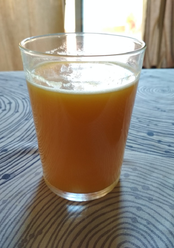 Una foto de Zumo de pera y naranja