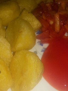A picture of Fried potatoes with carrot and tomato salad #allstarcontest.