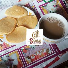 Pan cakes and chocolate cold drink A picture of Pan cakes and chocolate cold drink.